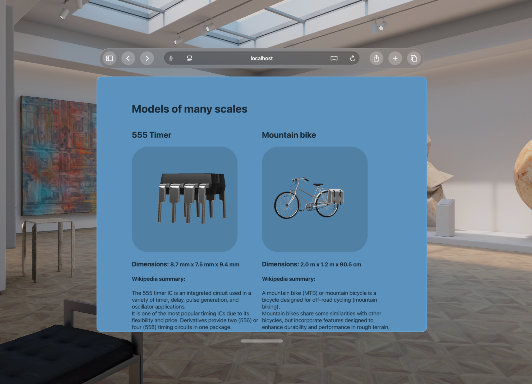 A screenshot from the visionOS simulator, showing a web page displaying two model elements and their respective bounding box information.